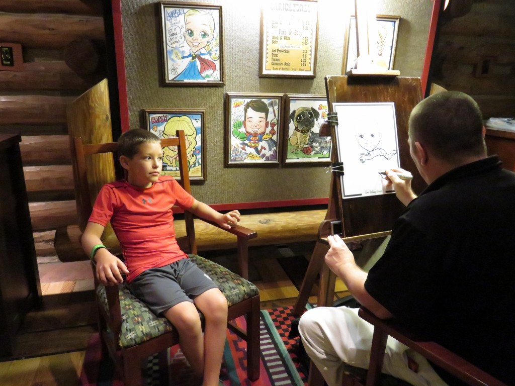 Having a caricature done at the Wilderness Lodge